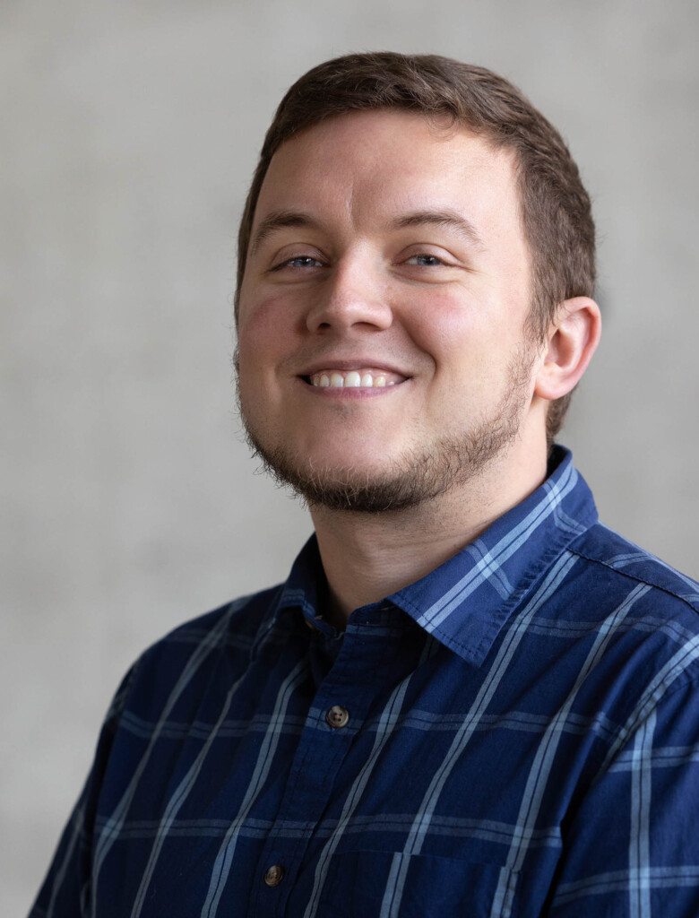 Photo of a caucasian male looking at the camera and smiling