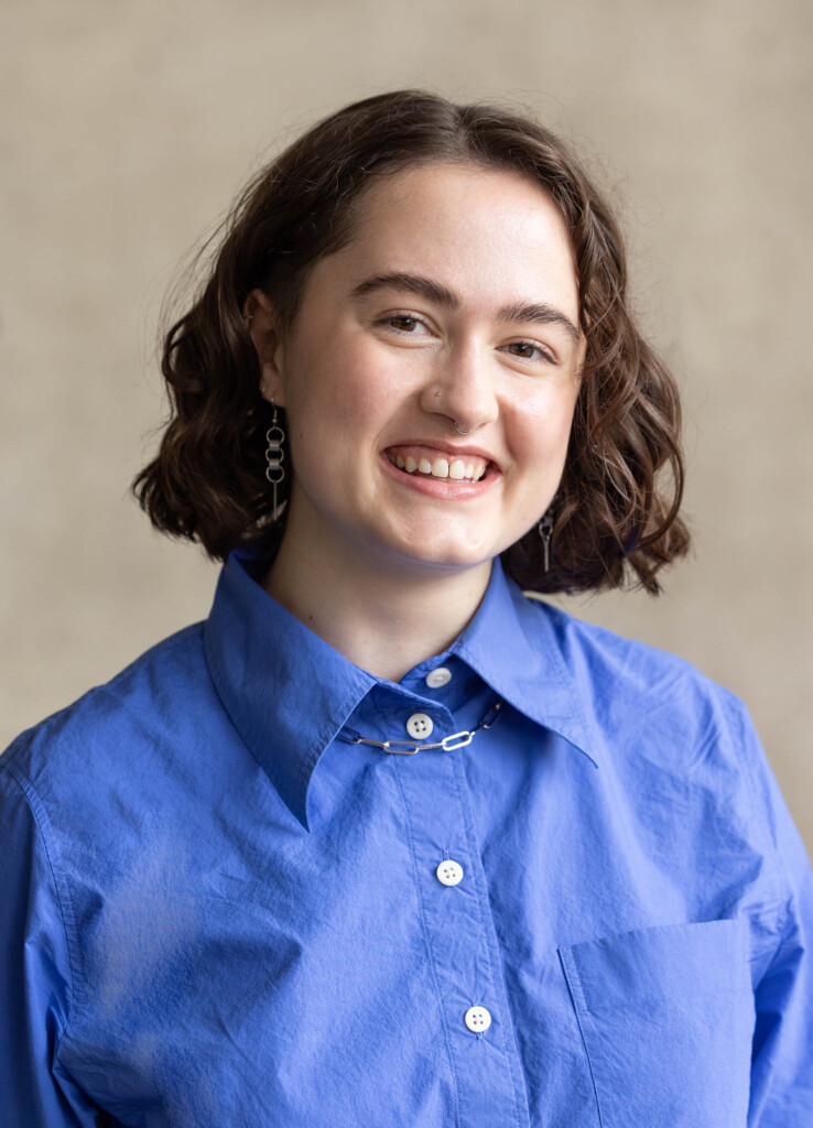 Headshot of a caucasian female, smiling at the camera