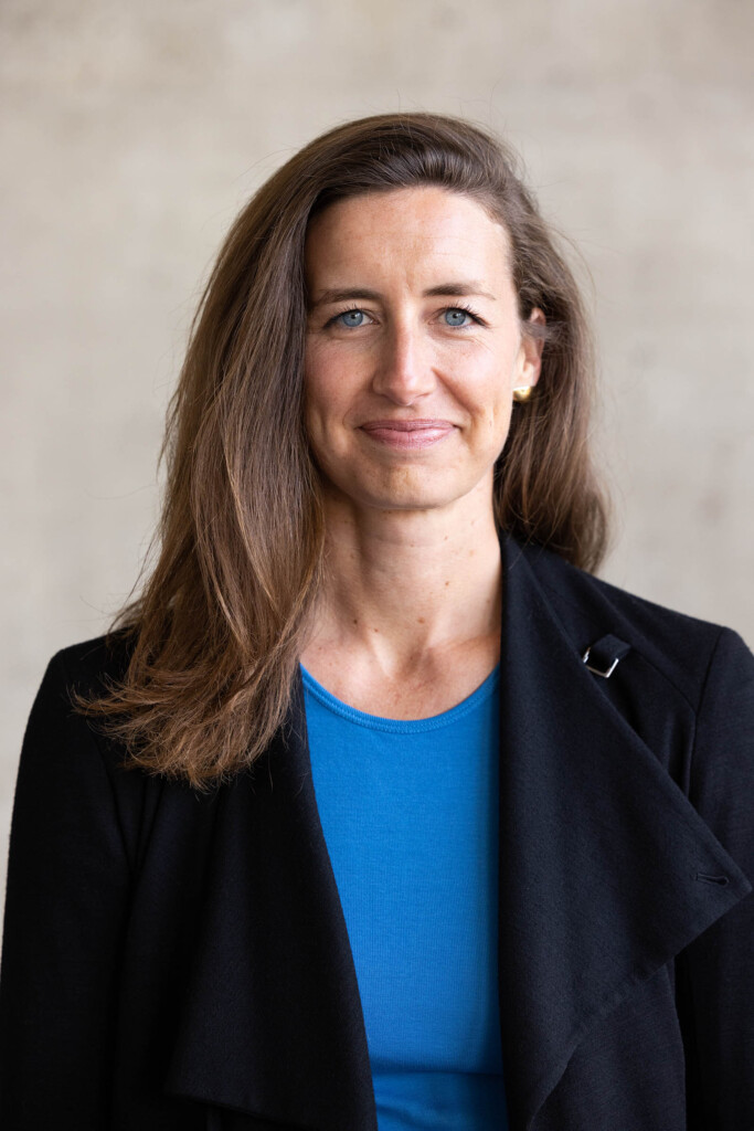 Photo of a female looking at the camera and smiling