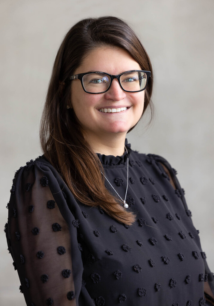 Headshot of a femaile smiling at the camera