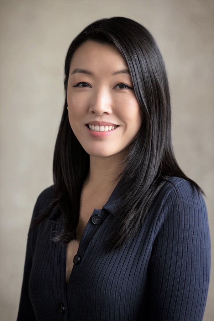 A headshot of a female smiling towards the camera