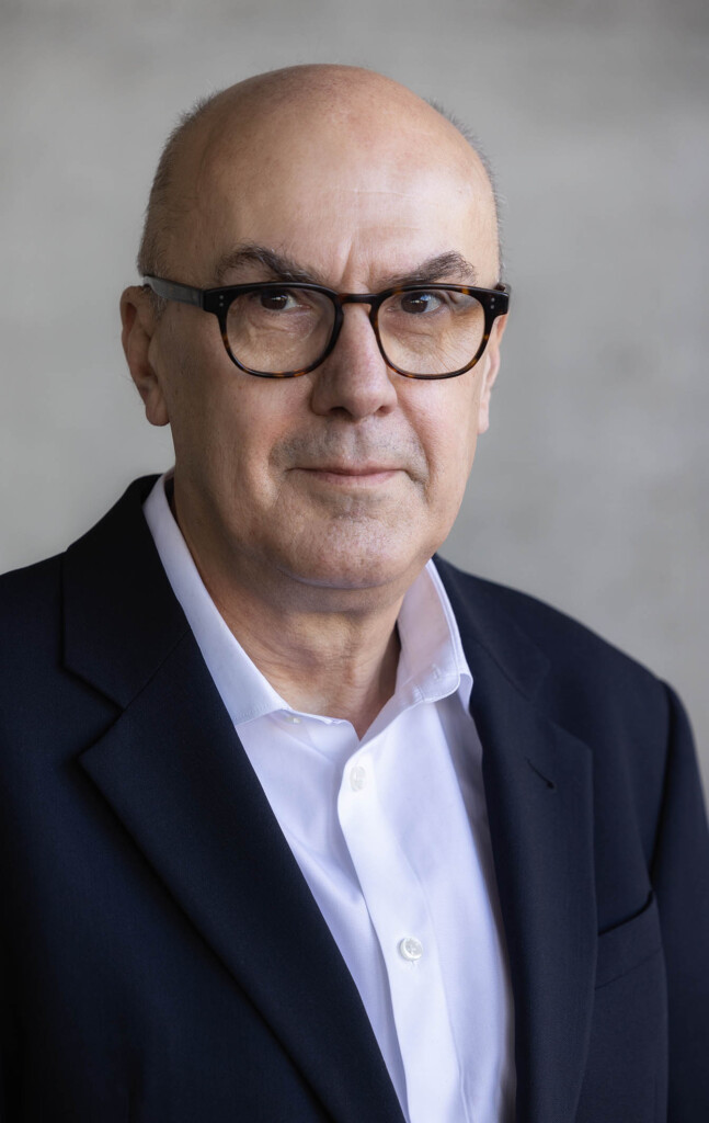 Headshot of a male looking at a camera