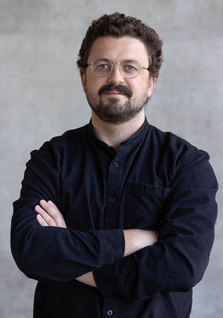 Headshot of a male looking into a camera