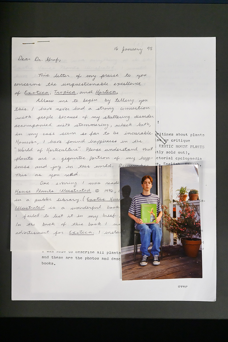 A collection of papers with a handwritten letter, a typewritten letter, and a photograph of a young man holding a botany book.