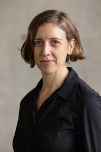 Headshot of Rachel Meltzer, who wears a black shirt.