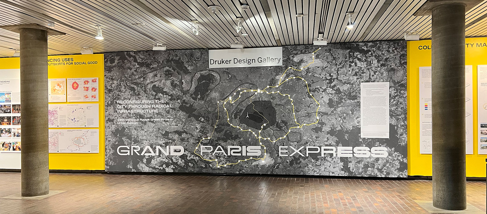 Exhibition wall showing a large map of paris, and the 68 new stations indicated by lights