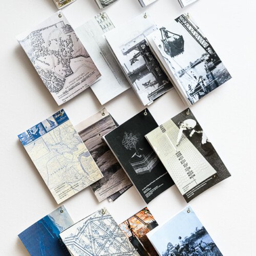 display of pamphlets, layered and hanging on small hooks