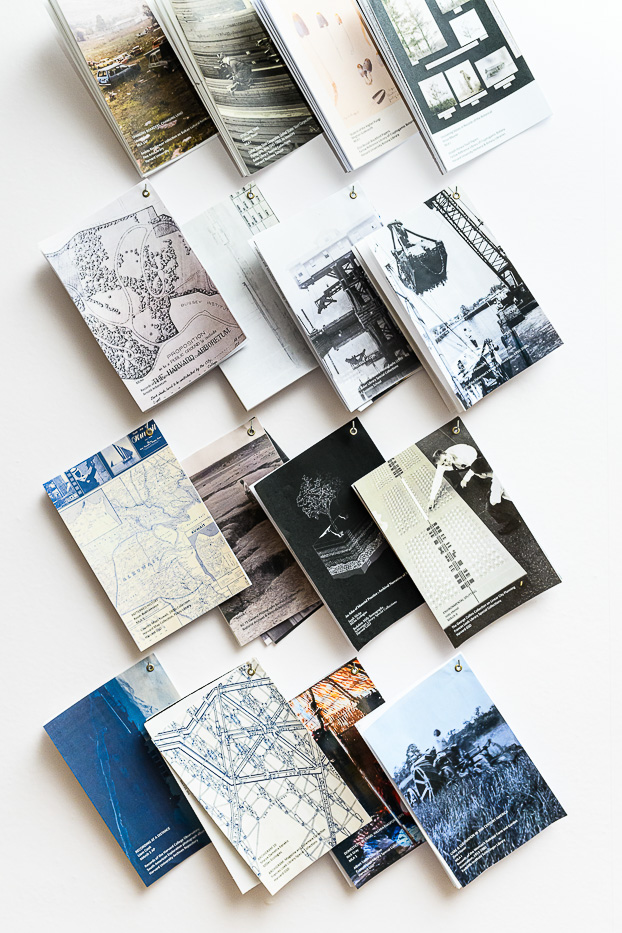 display of pamphlets, layered and hanging on small hooks