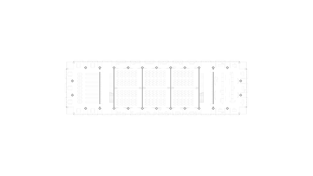 A ground floor plan showing the classrooms in the center of the building and communal spaces towards the ends.