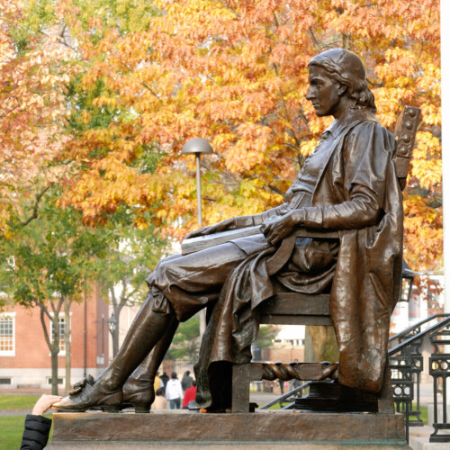 John Harvard statue in the fall