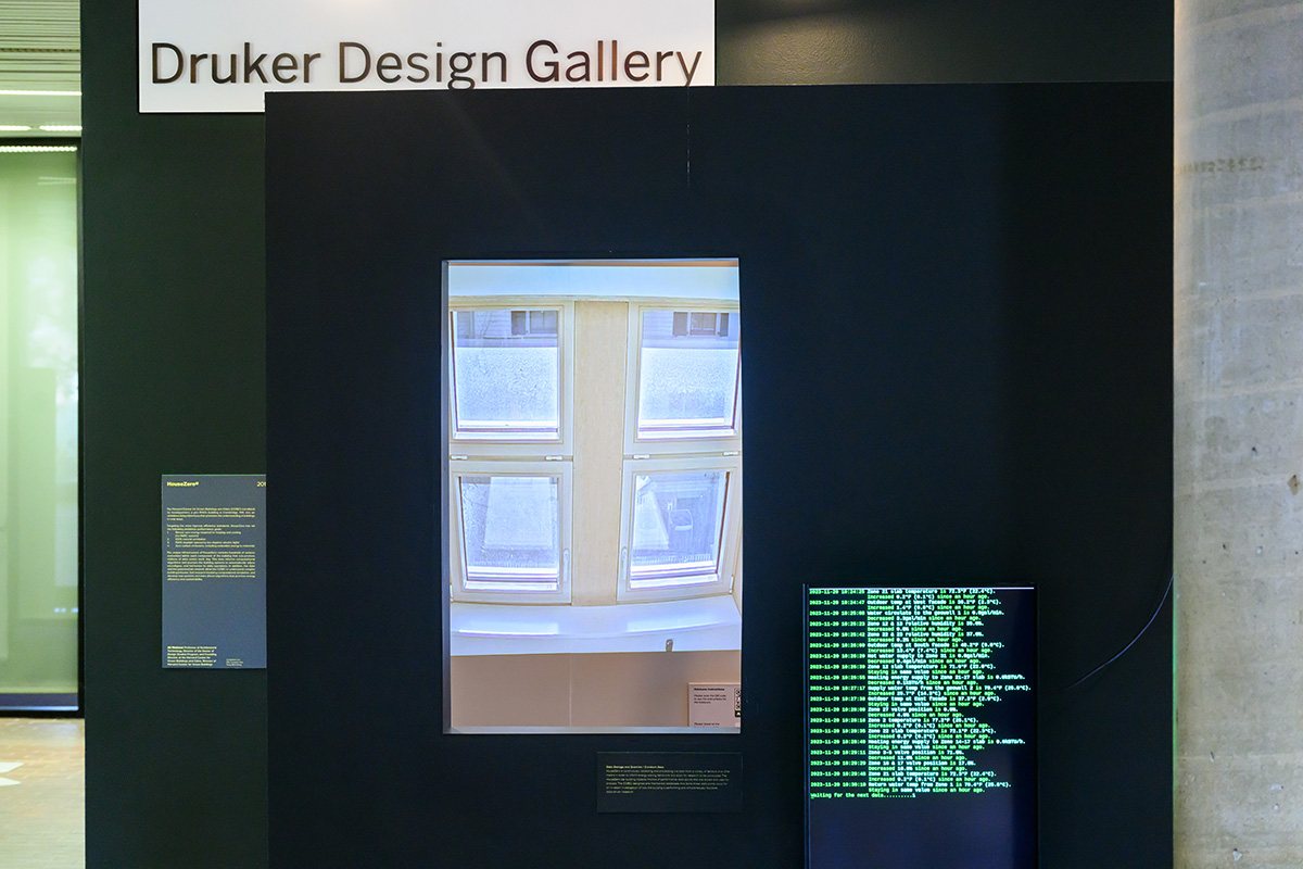 A detail of the exhibit showing a projection of an interior window next to a monitor with technical data.