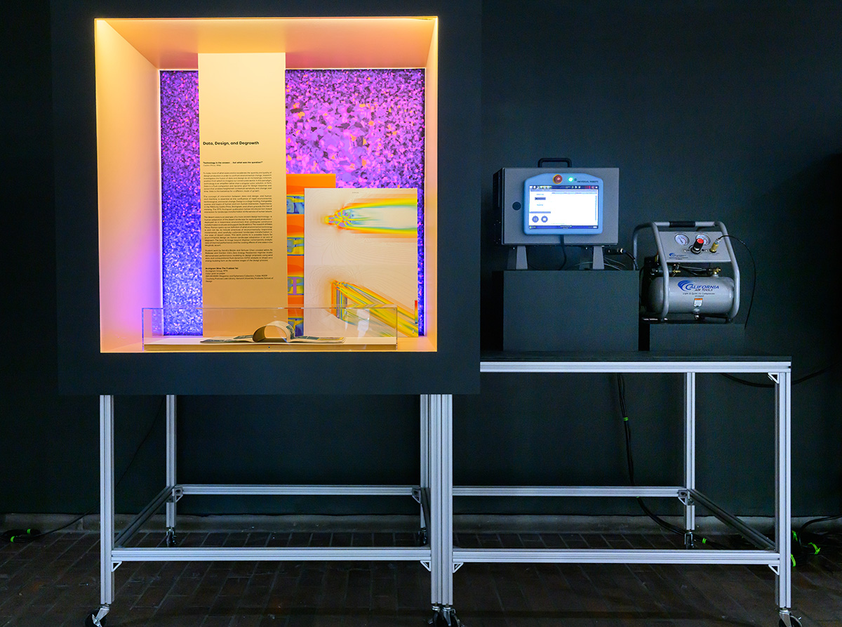 A detail of the exhibit showing items inside a colorful display case next to data-collecting instruments.