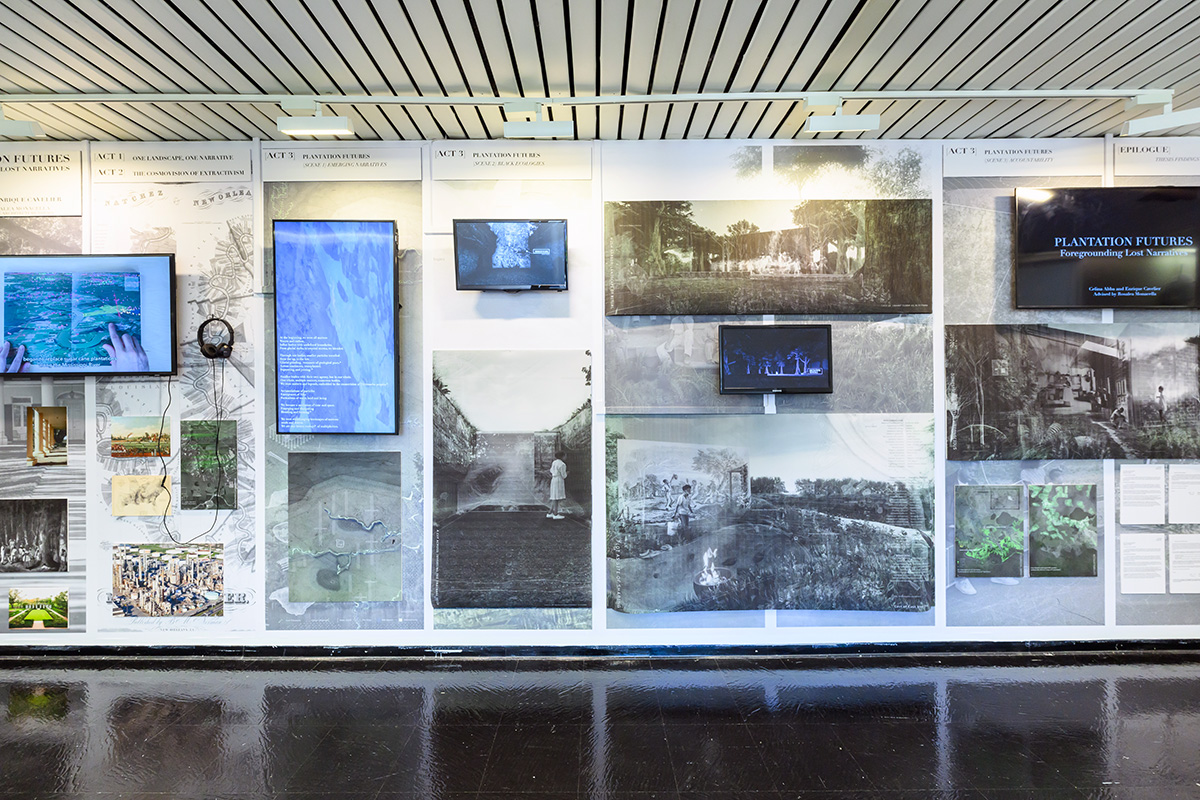 View of the exhibit showing a wall with images and video screens.