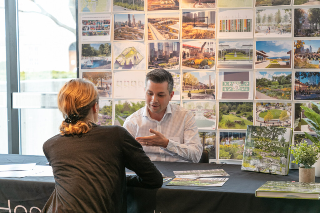 Photo of employer talking to student at job fair