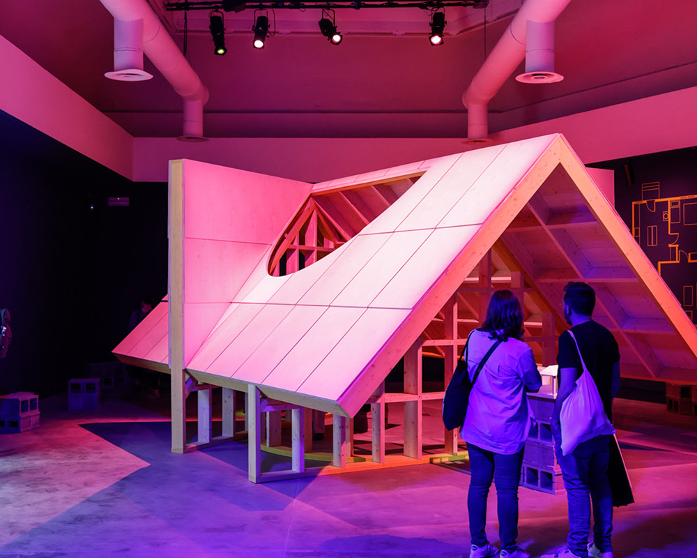 Two visitors look at the installation "Edgar's Shed" by Sean Canty at the Venice Biennale