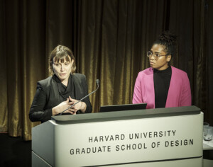Lisa Haber-Thomson and Dana McKinney White speak at a podium at Carceral Landscapes.
