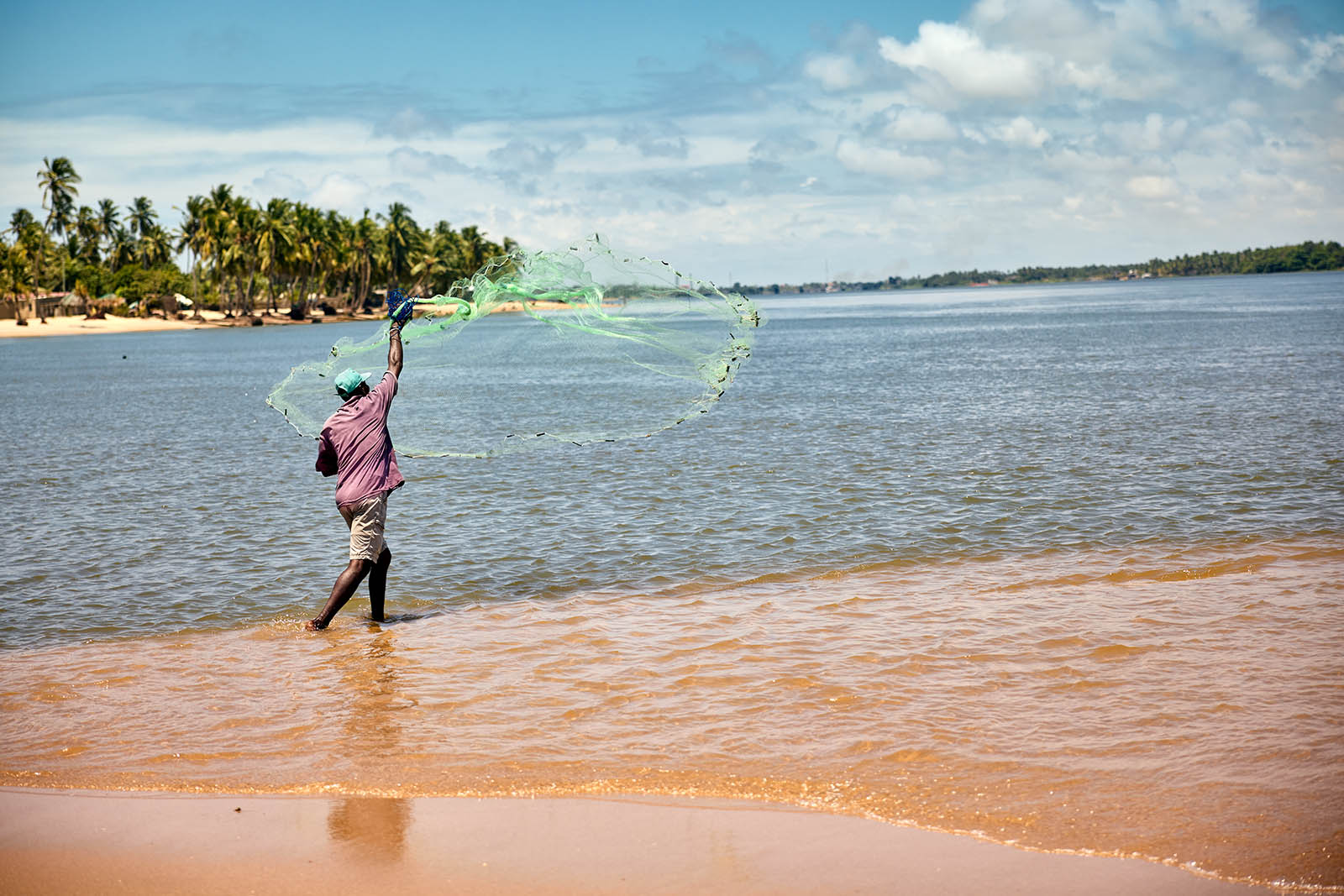 A man throwing a fishnet