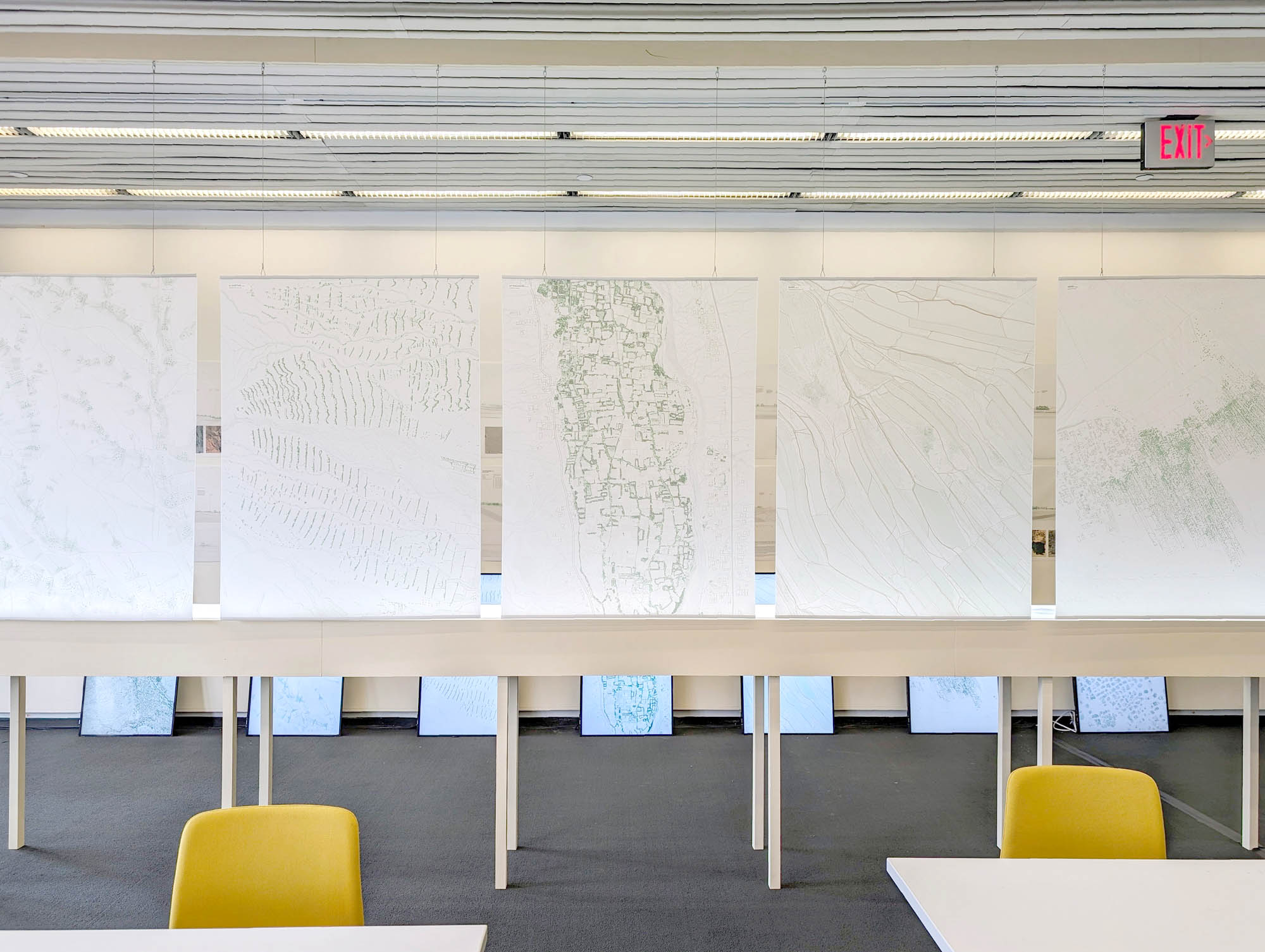 velum images over a table, and screens are just seen behind it