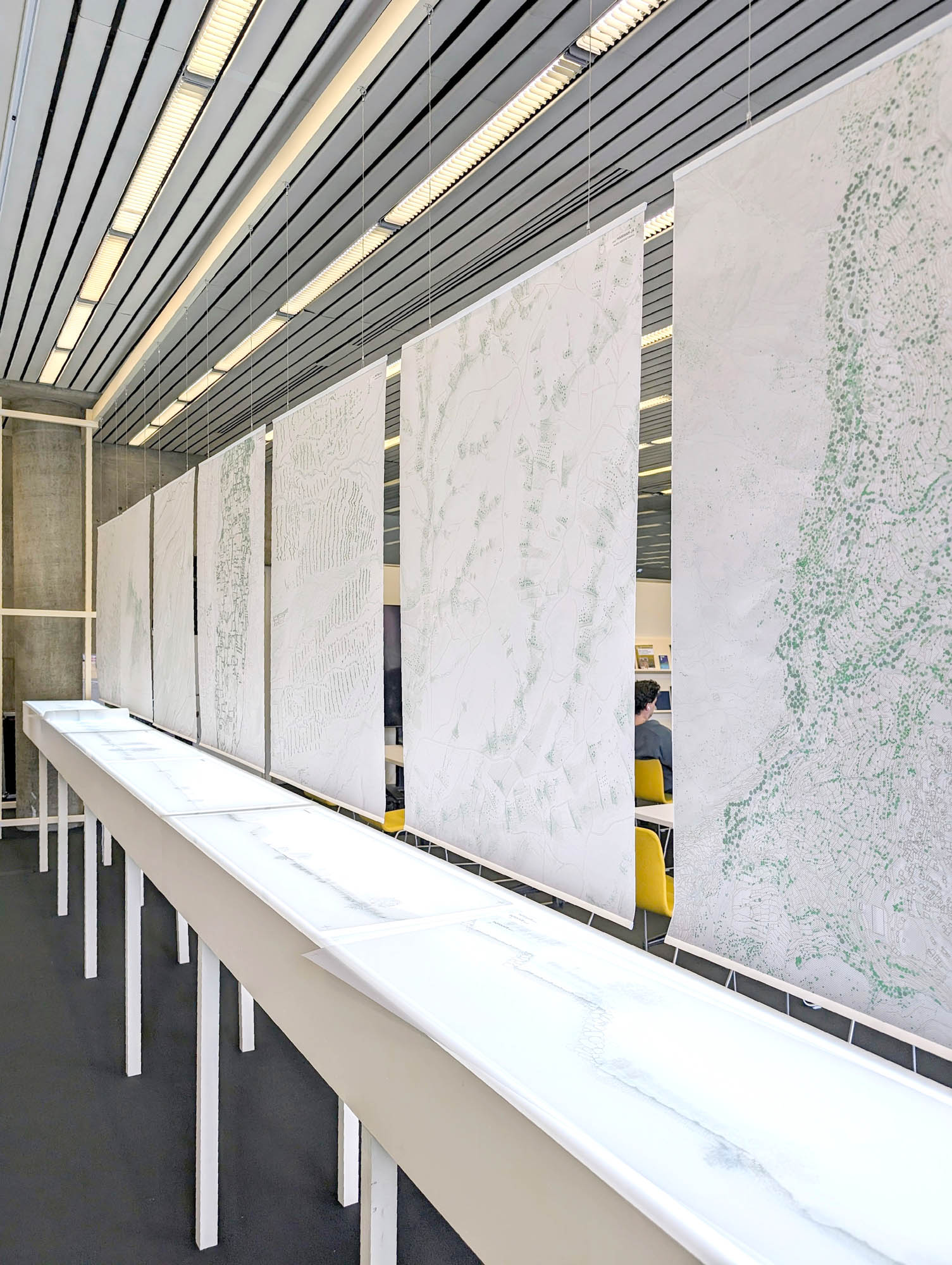 velum images over a table, and screens are just seen behind it