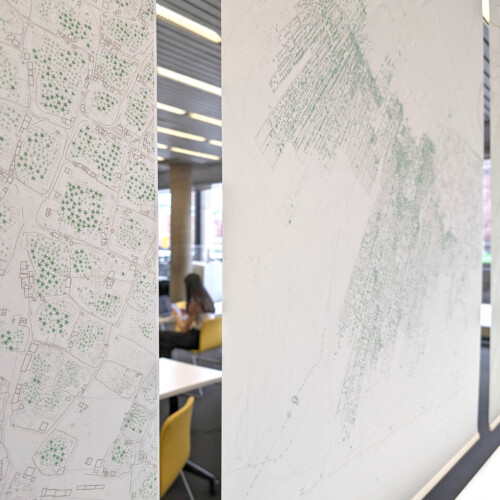 velum images over a table, and screens are just seen behind it