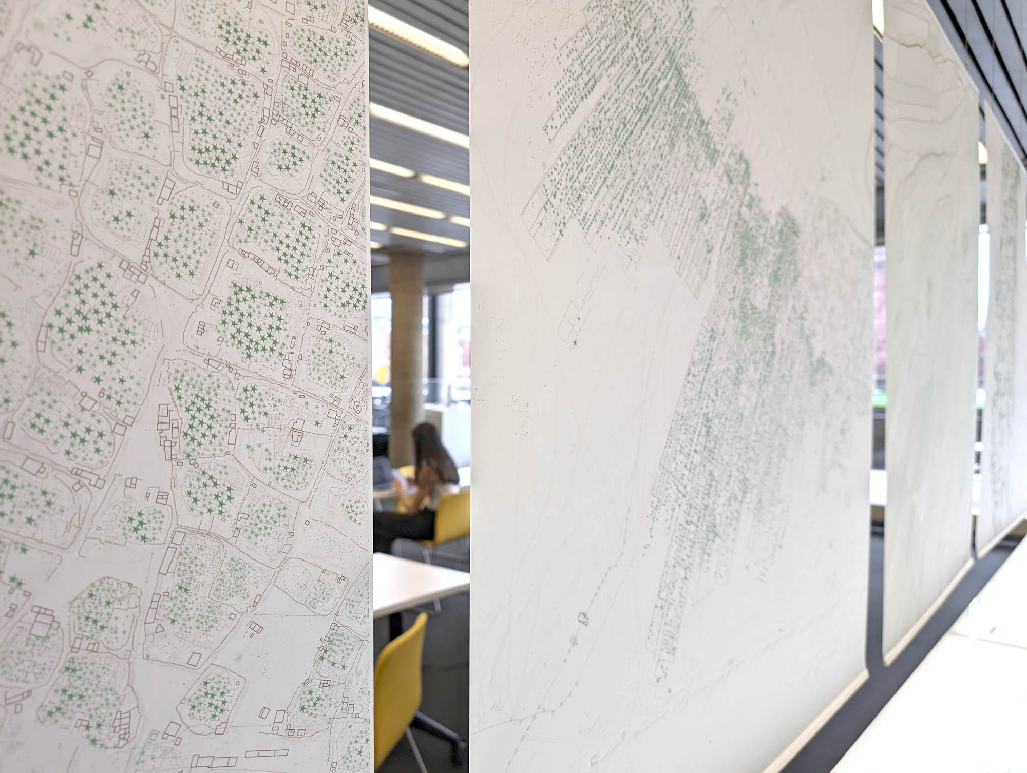 velum images over a table, and screens are just seen behind it