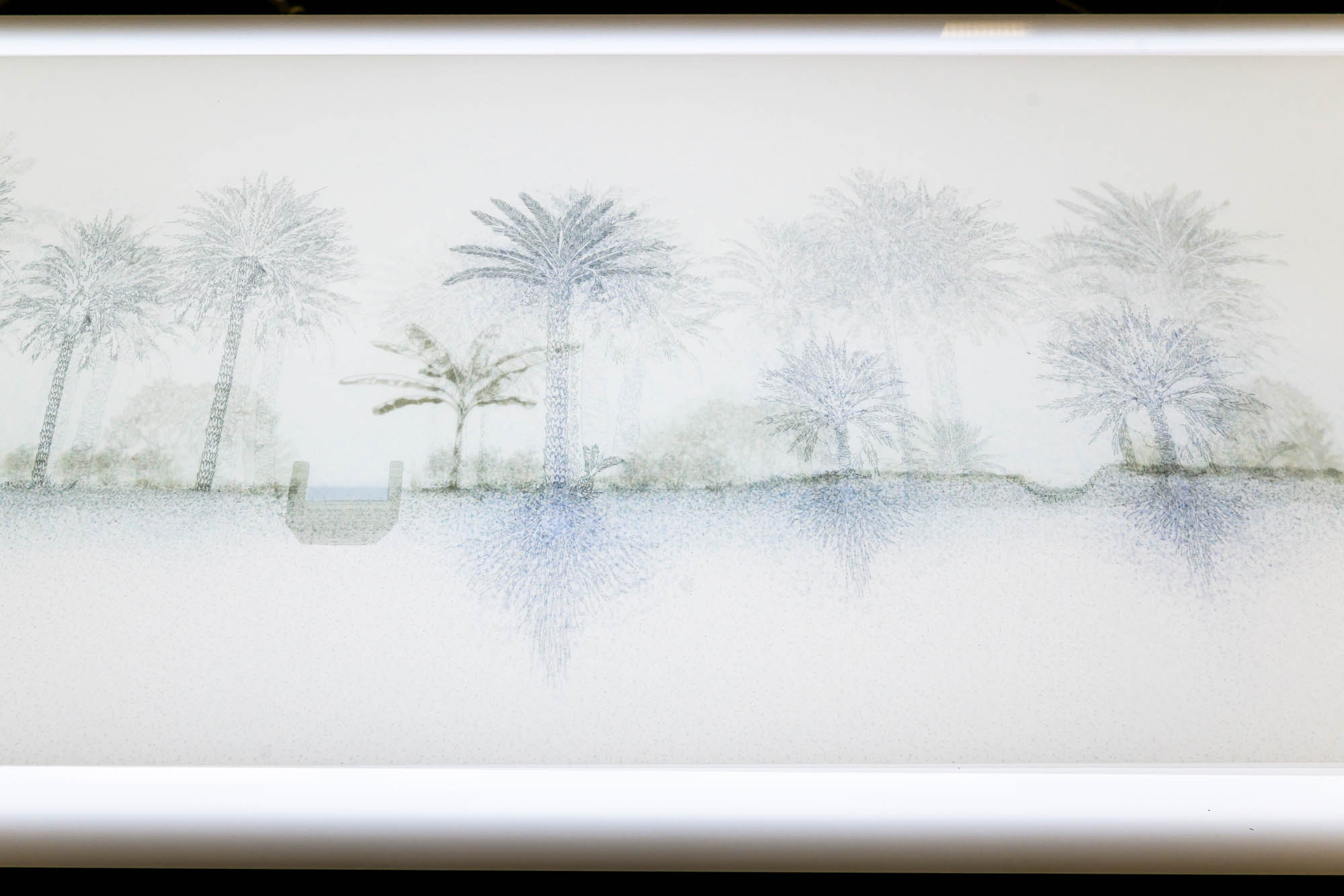 velum images over a table, and screens are just seen behind it