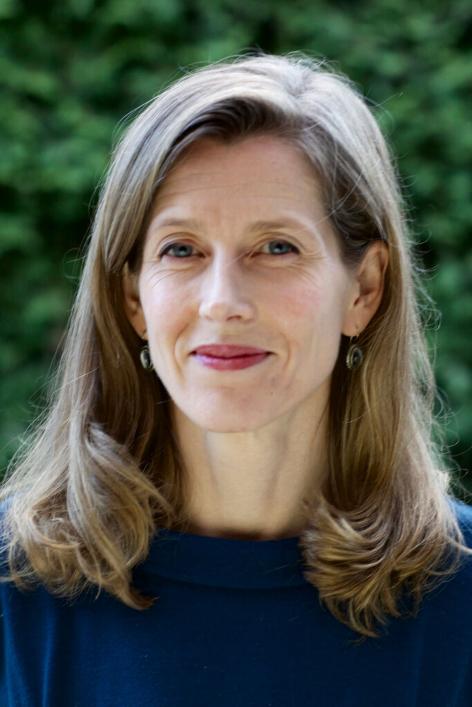A photograph portrait of Karenna Gore, who has shoulder-length hair and wears a dark blue top.