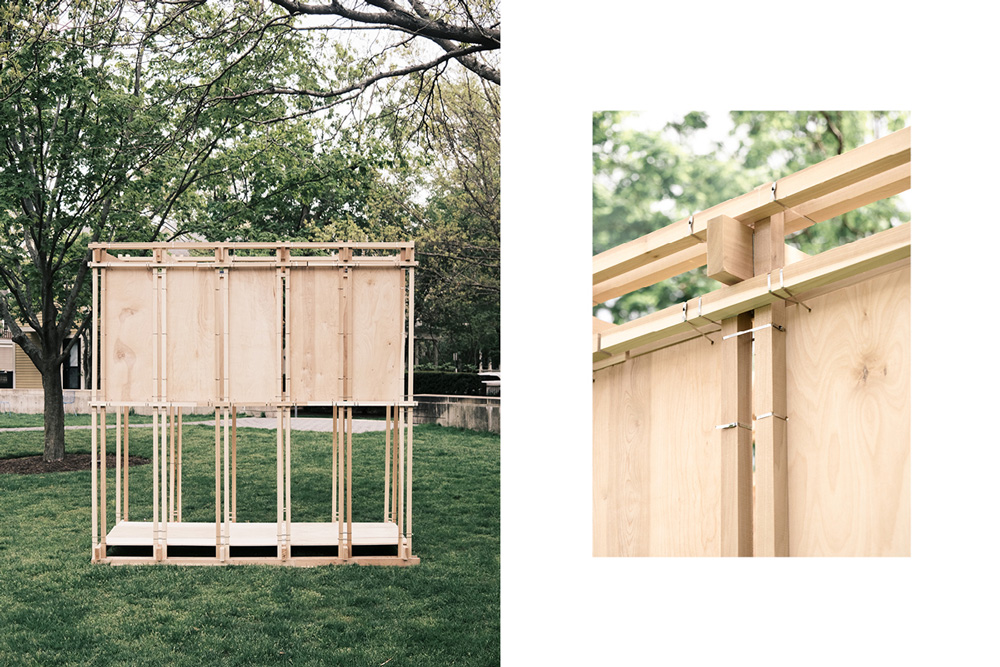 A photograph of a wood structure made of beams and panels bound together with metal fastenders.