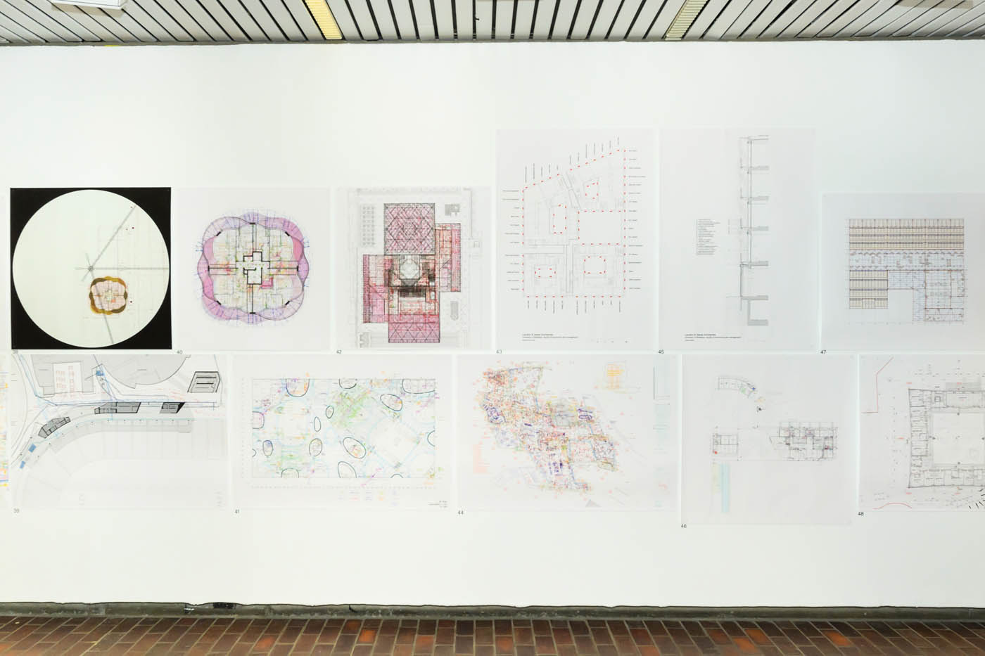 A wall of plan drawings.