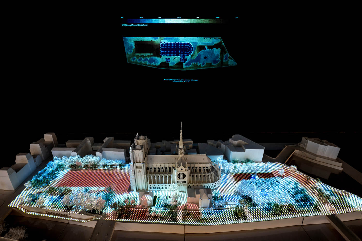 A model witha. projected diagram lighting it up.
