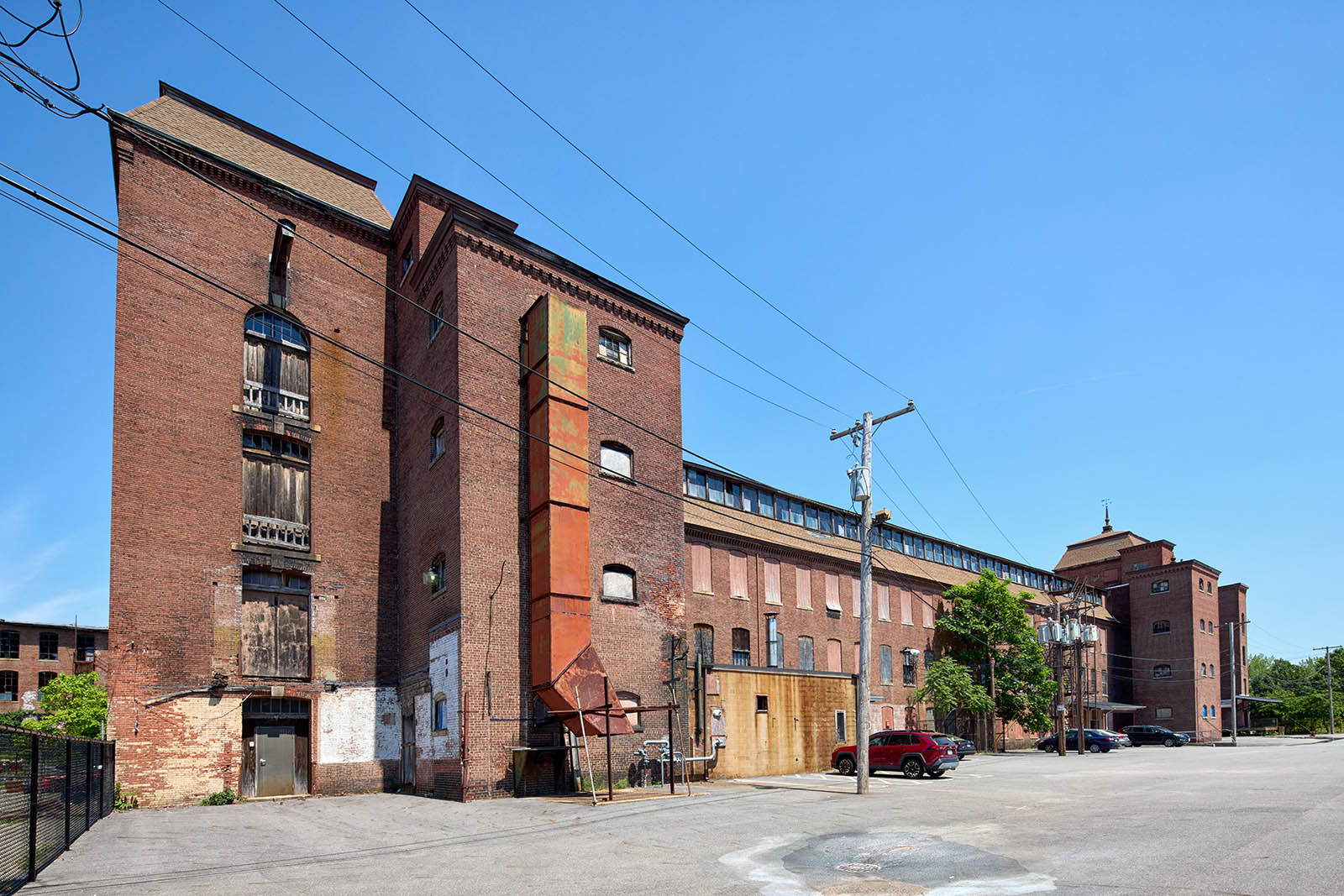 A frontal view of an old red brick building