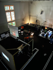 A photograph depicting the MDes Mediums domain open projects including a series of installations featuring lights and projections.