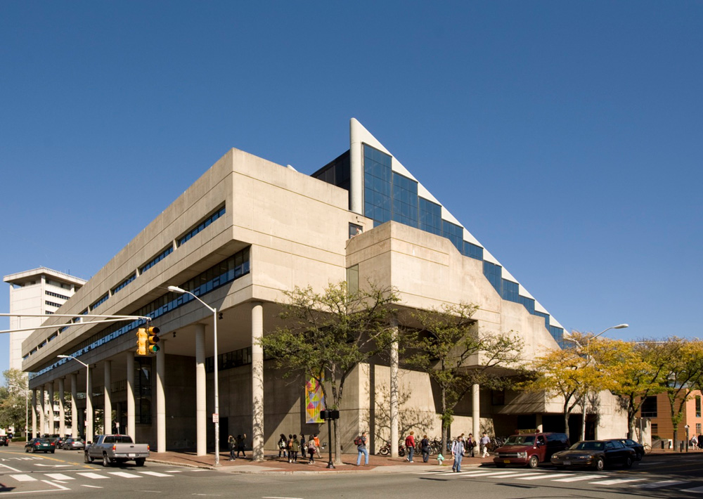 Concrete and glass building at intersection of two streets