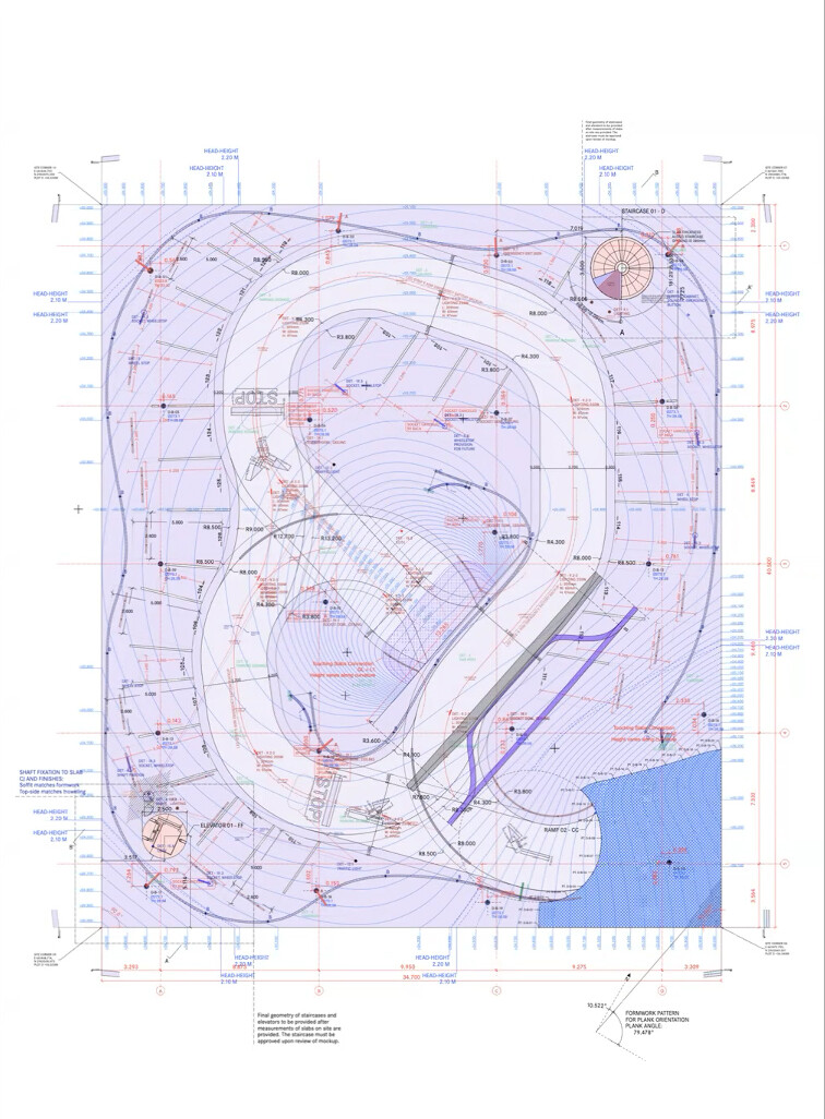 An architectural drawing showing the plan for a car park building with lines and markings in many colors indicating various building systems.