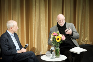Two men sitting and talking