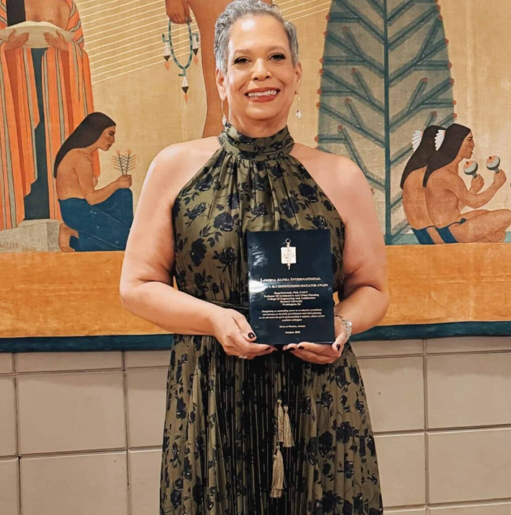 Hazel Ruth Edwards holding award plaque