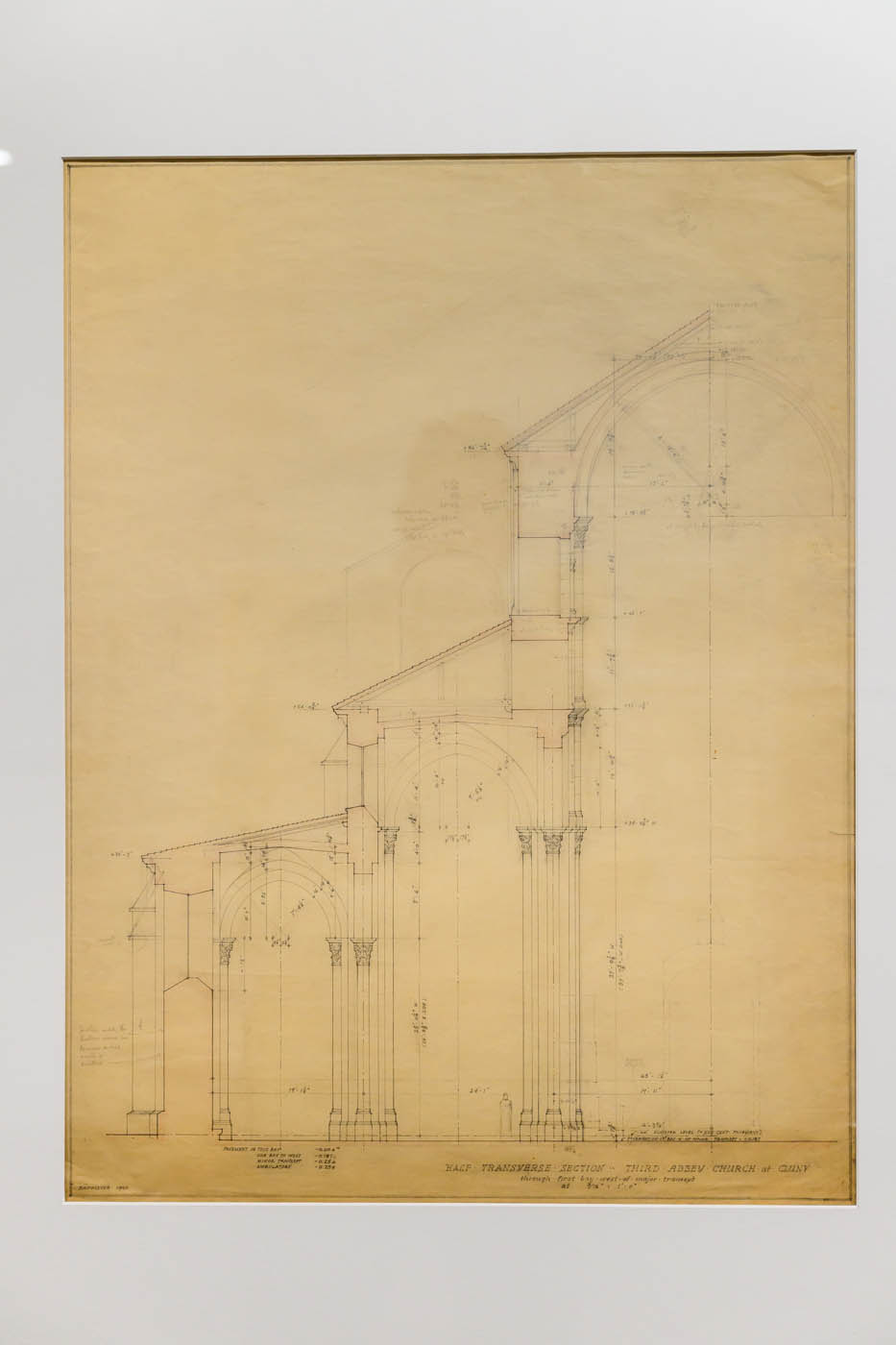 A framed drawing of a partial section of a church.