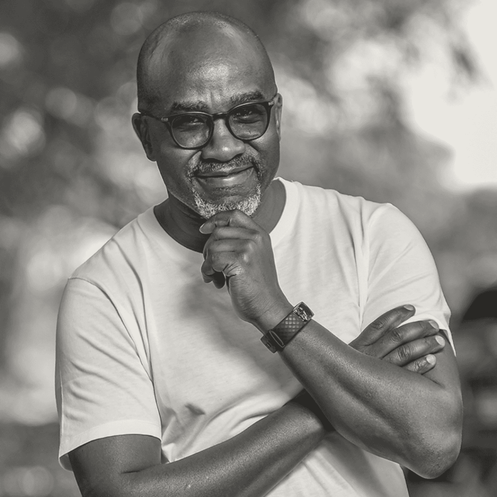 Black and white outdoor headshot of speaker Arthur Adeya.