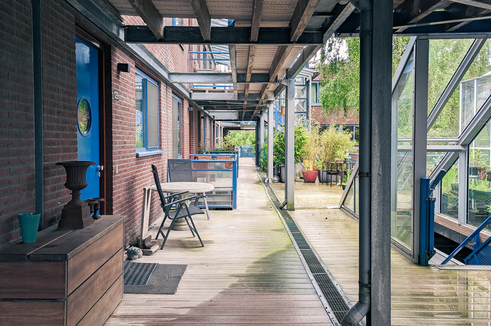 View down exterior courtyard of brick cooperative housing project