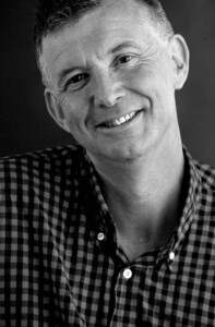 Grayscale headshot of Peter Barber