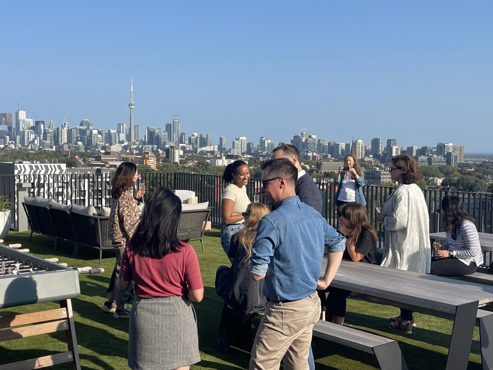 Rooftop gathering howcasing Toronto skyline