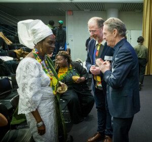 Princess Adedoyin Talabi Faniyi is greeted by two men at the Graduate School of Design.