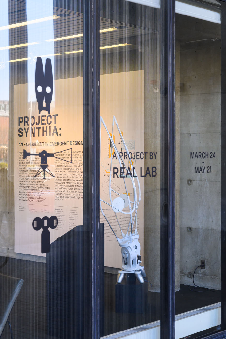view of rabbit eared model and instroduction through tall windows