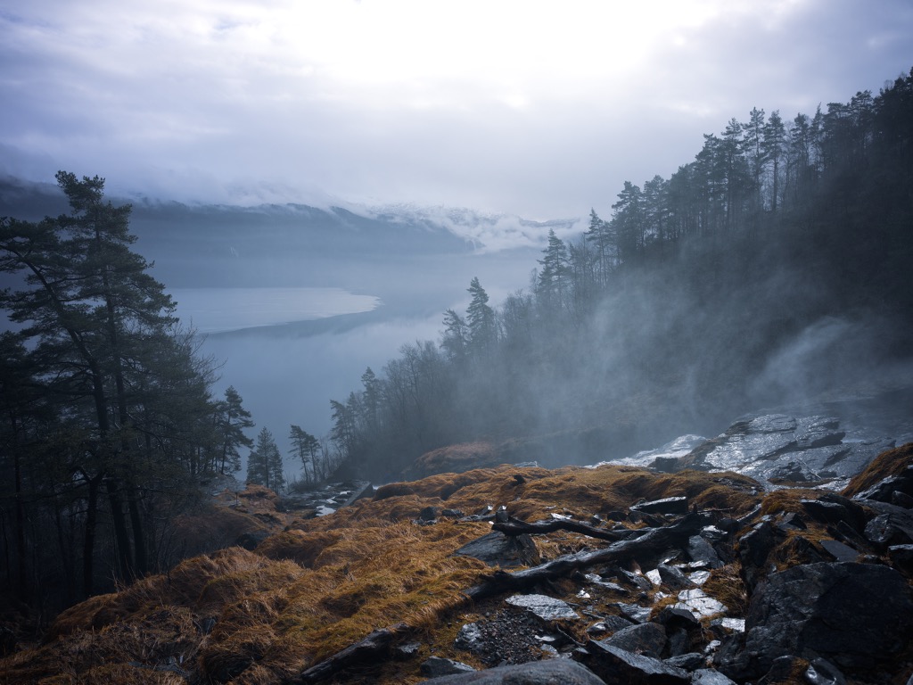 foggy mountains and ocean in distance