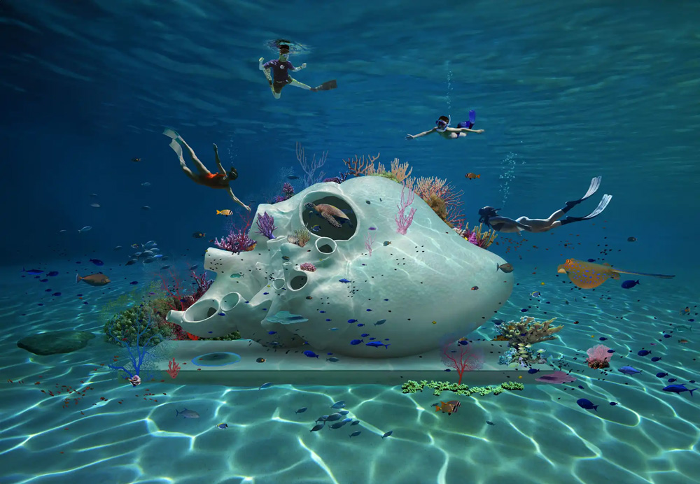people snorkeling with sculpture