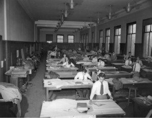 A historical photograph of architecture students working in Robinson Hall at the Graduate School of Design.