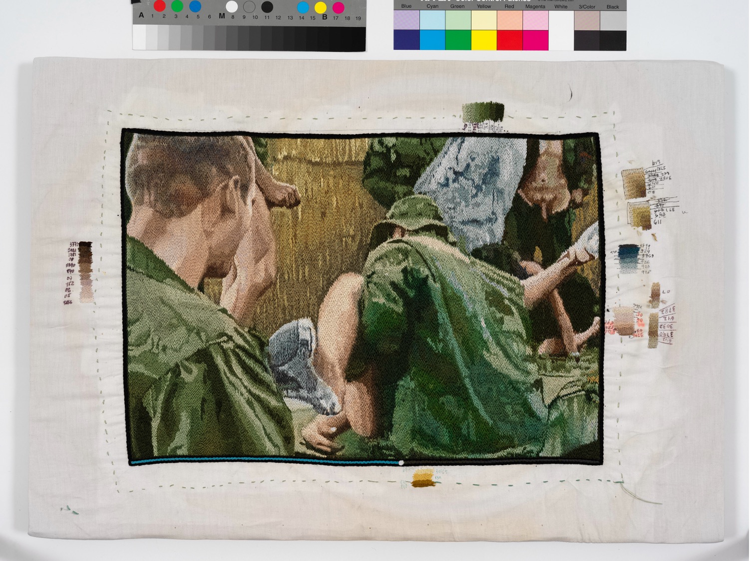 embroidered image of men in green