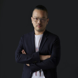 man standing with crossed arms