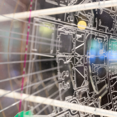 Detail of a model with etched lines on layers of acrylic.