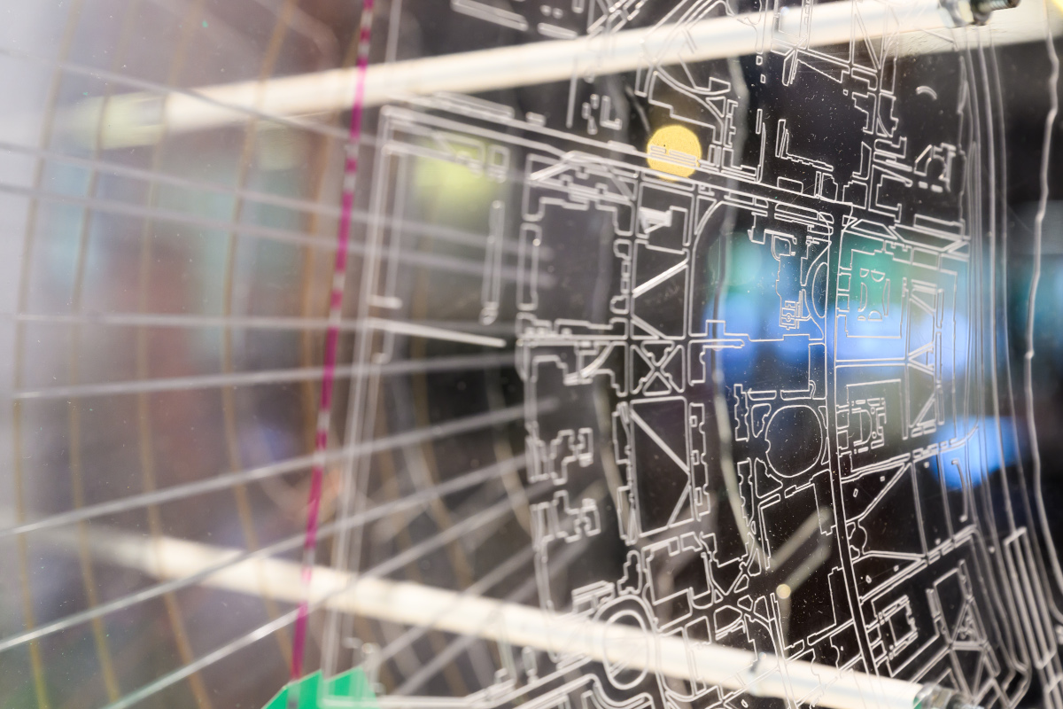 Detail of a model with etched lines on layers of acrylic.